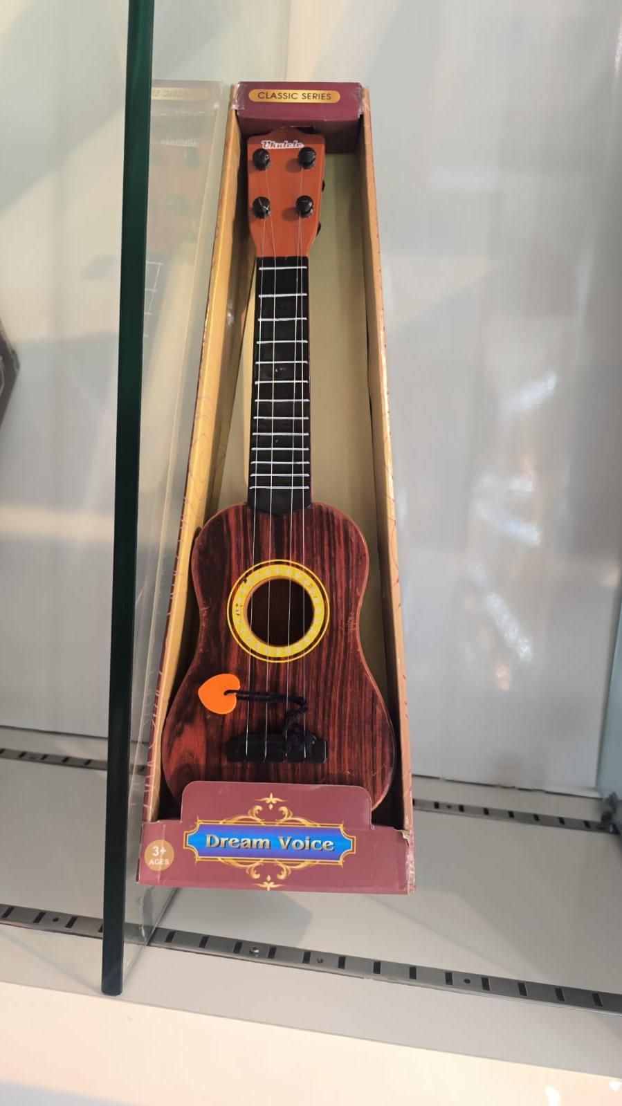 Mini Wooden Finish 4-String Guitar – Kids Musical Ukulele Toy